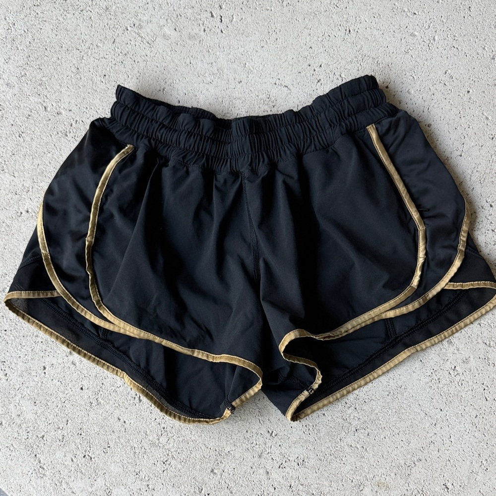 Black and gold lululemon run tracker shorts size 6